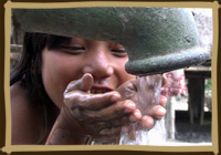 assam child drinking from faucet
